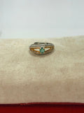 Anillo de esmeralda corte oval diseño puente