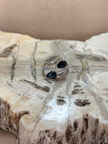 Anillo de topacio london blue corte oval diseño único dos piedras